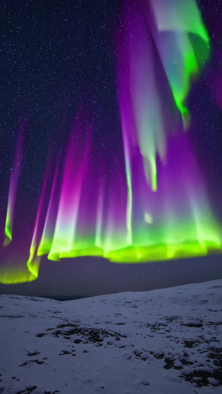 Aurora Borealis over Snowy Landscape