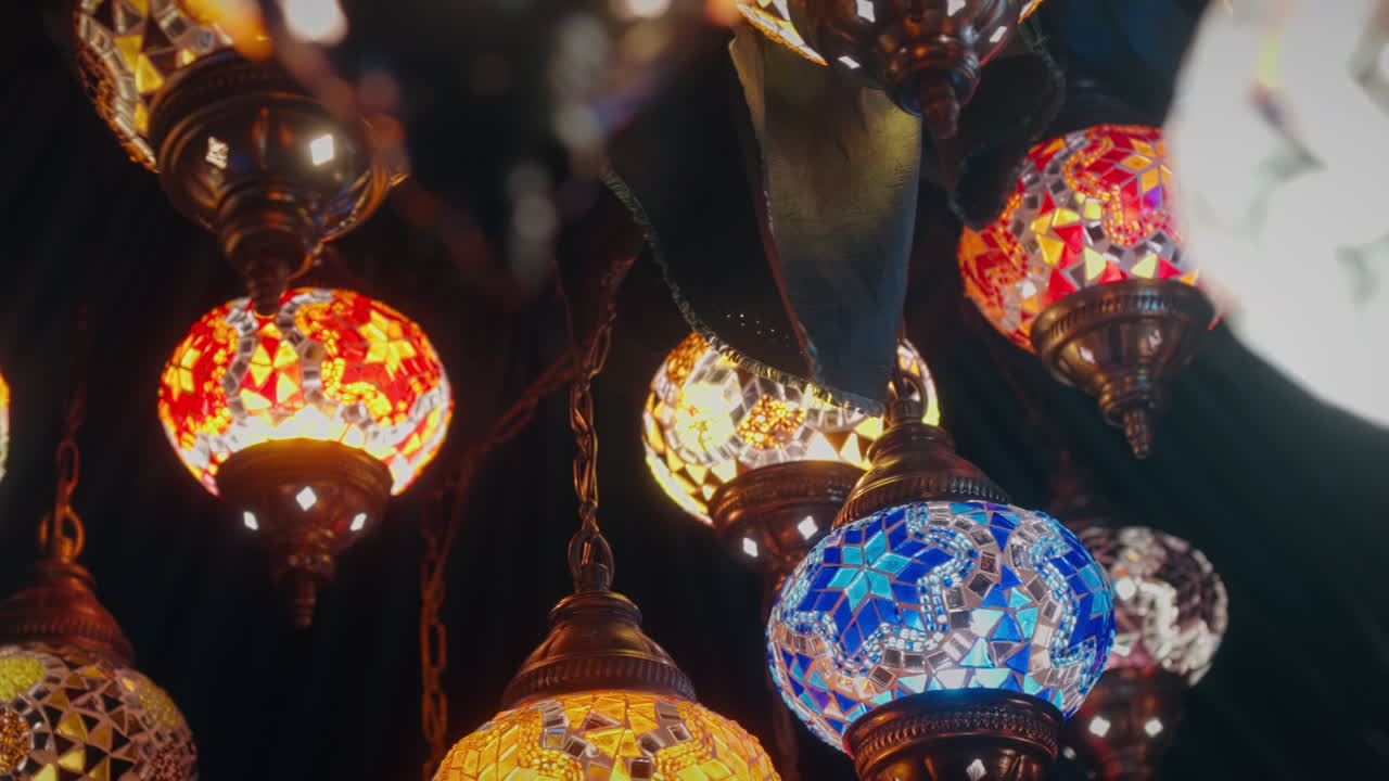 Vibrant mosaic glass lamps glowing inside traditional market in Istanbul, Turkey