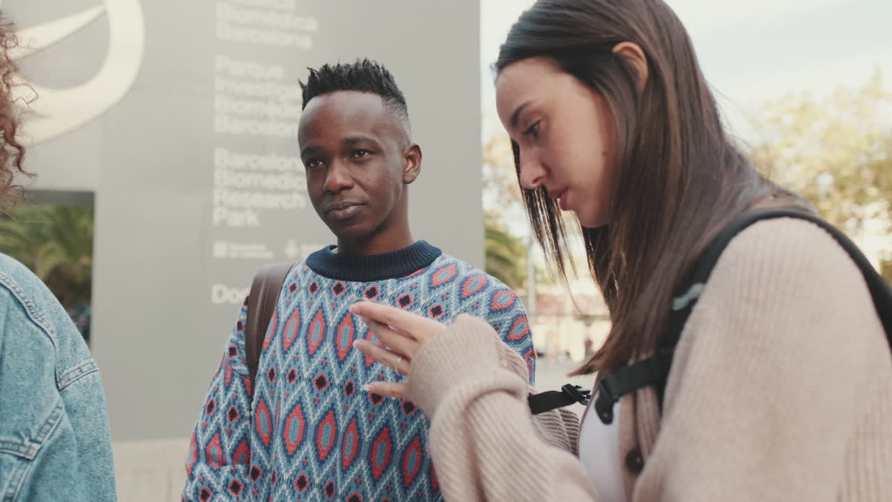 People Looking At Phone Outdoors