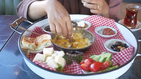 woman enjoying a delicious turkish breakfast