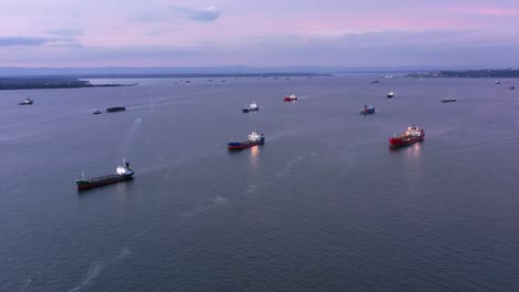 Coast-full-of-Oil-and-LPG-Tankers-in-the-evening---Aerial-shot---Port-of-Balikpapan-city---Indonesia