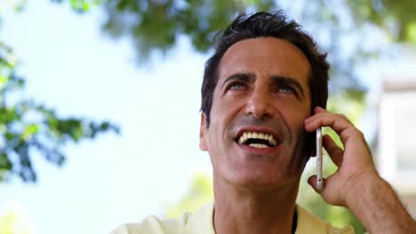 Smiling-man-talking-on-mobile-phone