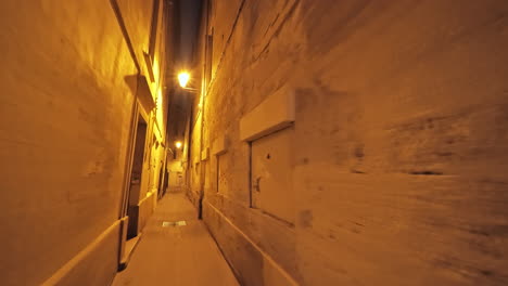 Very-narrow-streets-by-night-in-Montpellier-downtown-France