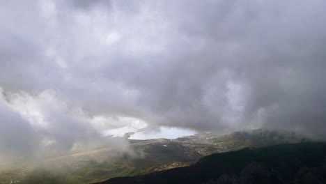 flying towards bay of kotor, aerial panorama with stormy skies, montenegro wild beauty