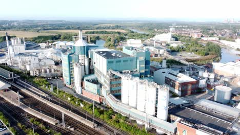 Industrial-chemical-manufacturing-factory-next-to-Warrington-Bank-Quay-train-tracks-aerial-view-front-to-side-orbit