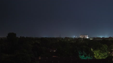 Time-lapse-sequence-of-thunderstorm-lightning-at-night-over-a-village