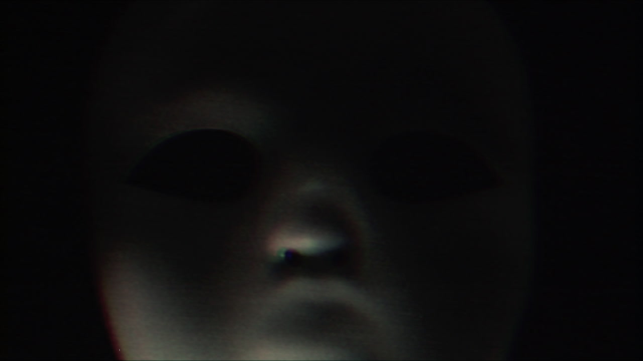 Mysterious White Mask in Darkness