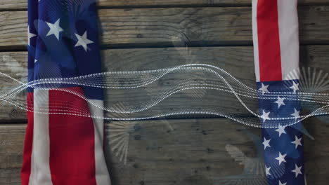 american flags with flowing wave animation over rustic wooden background