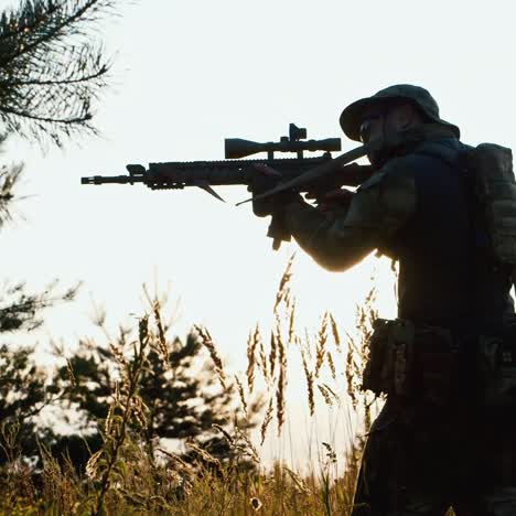 a solider aims his rifle 4