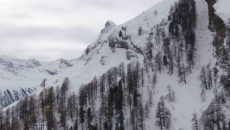 reveal scenic cinematic aerial drone most famous snow cover mountain matterhorn zermatt switzerland october november heavy fresh snowfall winter on climbing peak to the left circling movement