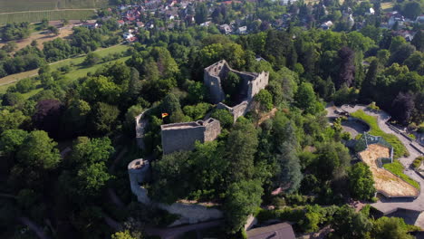 drone pullback from ancient burg baden atop hillside overlooking badenweiler