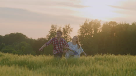 happy couple rejoicing and running at golden hour sunset