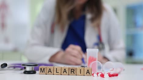 medical concept of malaria with doctor, medication, and stethoscope