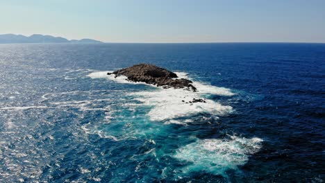 idyllic seascape with blue water and foamy waves in jerusalem beach, erisos, greece - aerial drone shot