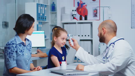 pediatrician checking ontemperature