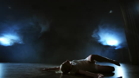 Woman-in-white-dress-on-stage-with-smoke-dancing-modern-ballet