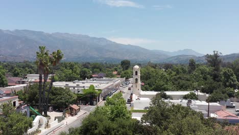 Low-rising-aerial-shot-of-quaint-downtown-Ojai,-California