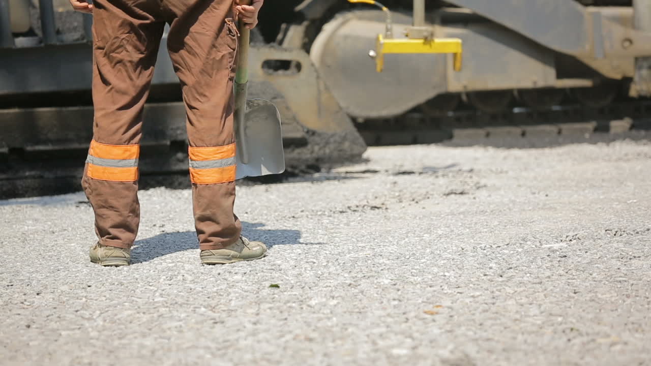 Laying Asphalt With Road Construction. Road rollers building the new asphalt road