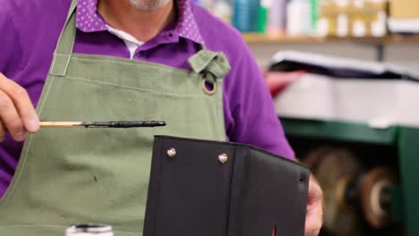 traditional italian shoemaker making a leather baglocation: northern italy