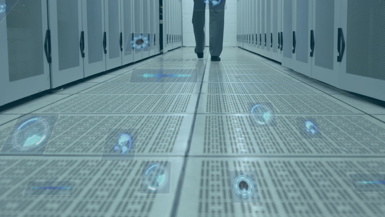 Multiple round scanners against mid section of man walking in computer server room