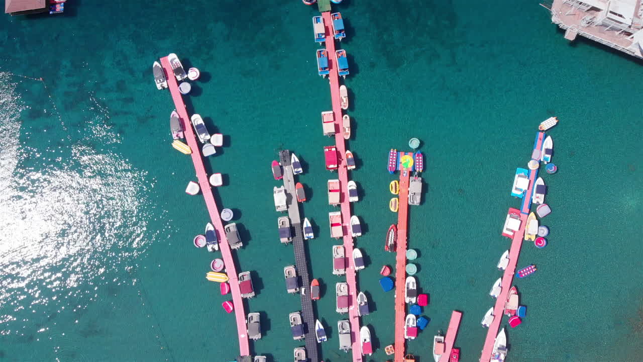 Aerial Footage over Deck Marina With Speed boats Top Down view