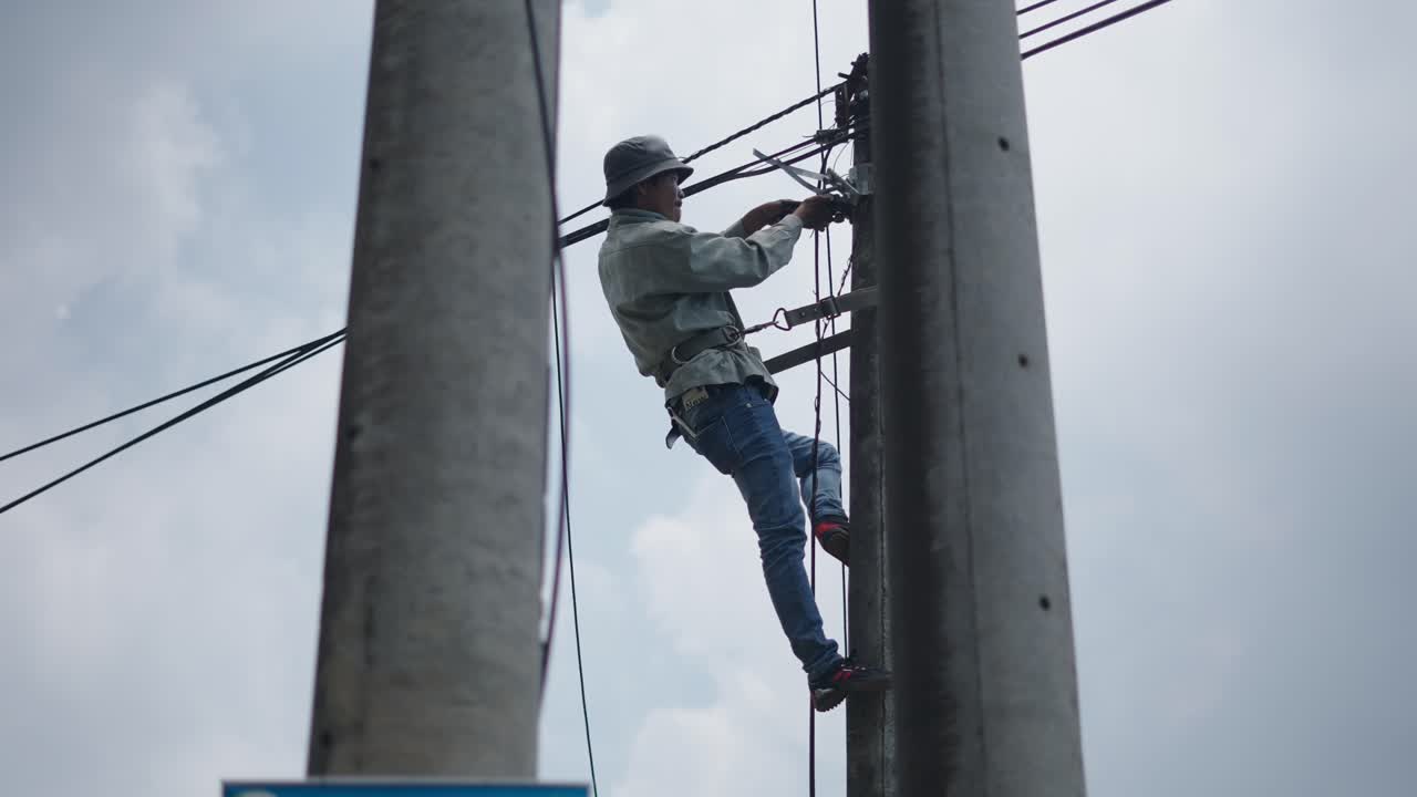 Electrician working on power lines