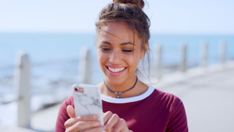 Video-call,-phone-and-young-woman-at-the-beach