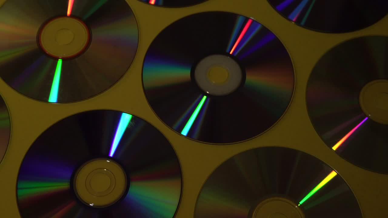 Vintage CD or DVD disk background, old circle discs used for data storage, share movies and music