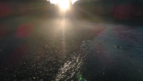 morning sunrise river shore aerial in hazy forest fog