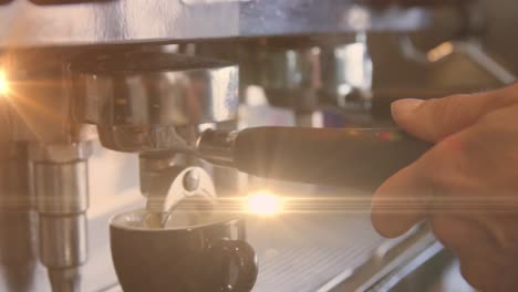 Animation-of-glowing-orange-light-over-caucasian-male-barista-making-coffee