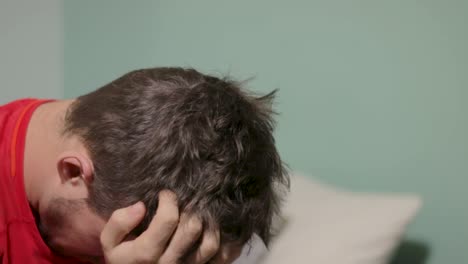 medium close up of a man staring in front of him looking concerned