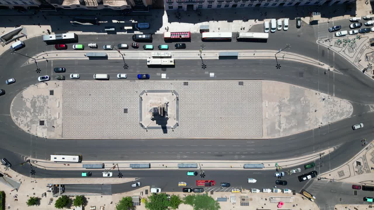 Bird's eye view of cars driving in downtown Lisbon at Restauradores square,Portugal