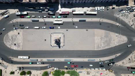 bird's eye view of cars driving in downtown lisbon at restauradores square,portugal