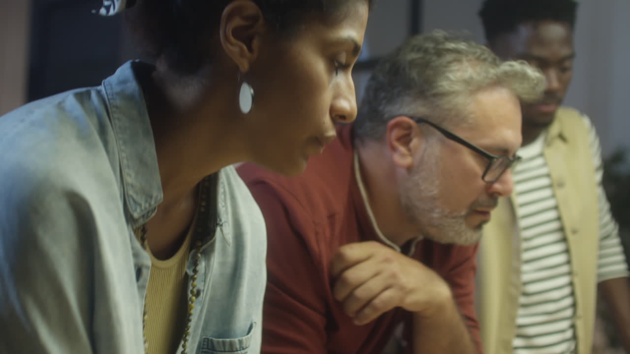 Business Team Working on Project at Night