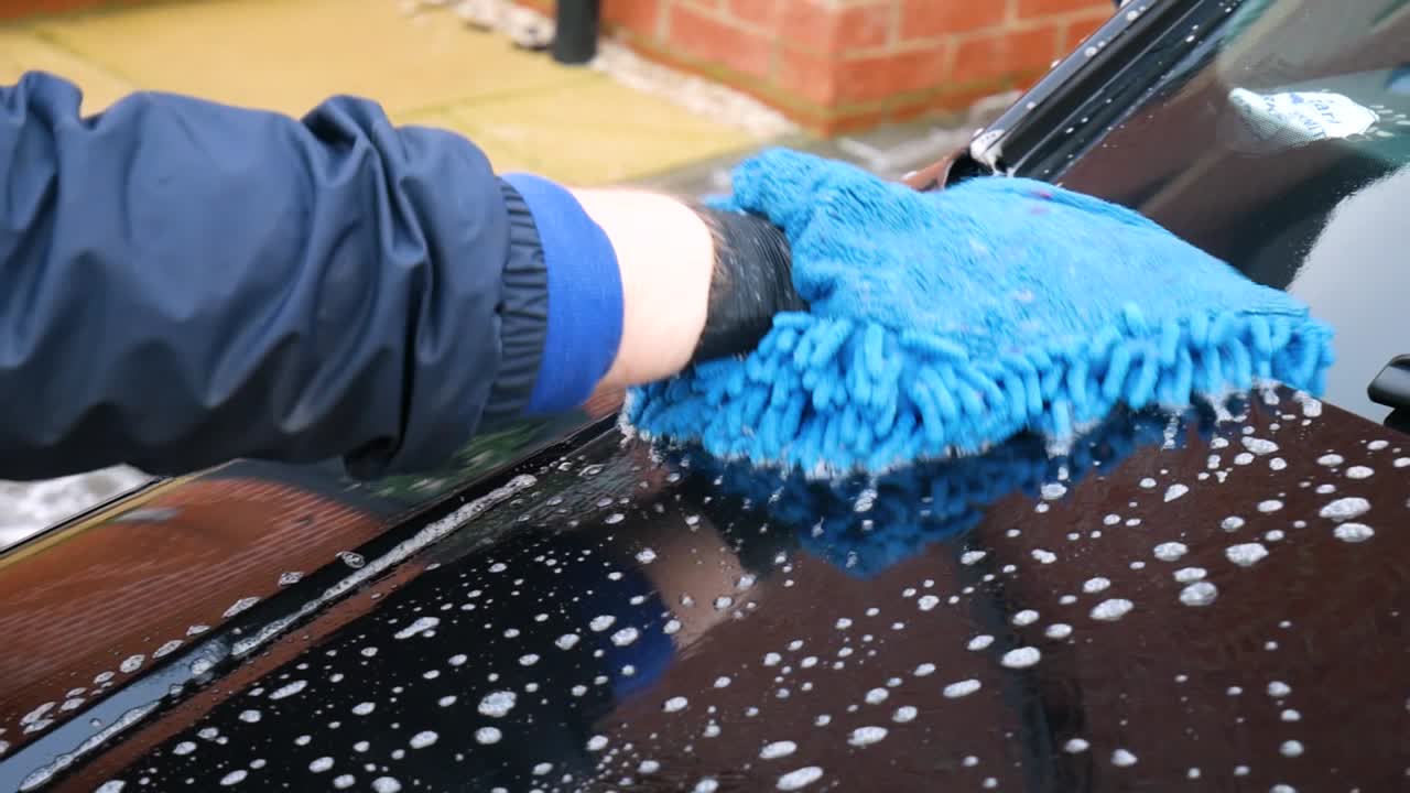 Washing Black Car Bonnet Hood With Microfibre Noodle Mitt