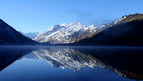 morning fog above mountain lake seamless loop