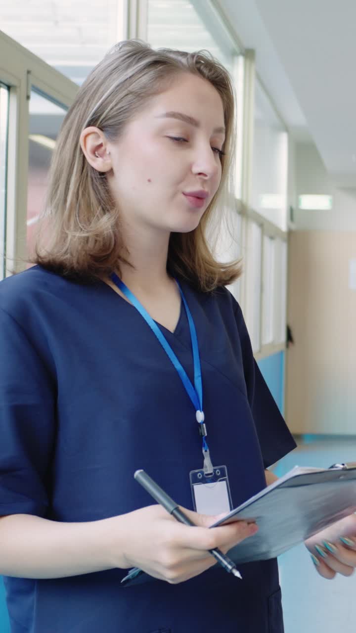 Healthcare professional in a hospital hallway