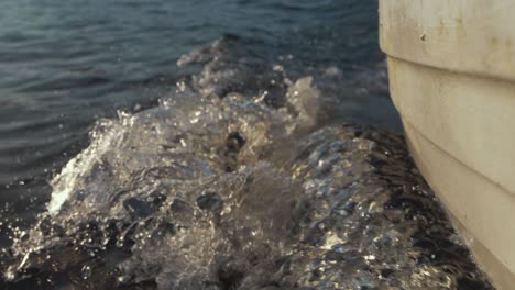 wake off hull of lake boat driving through water