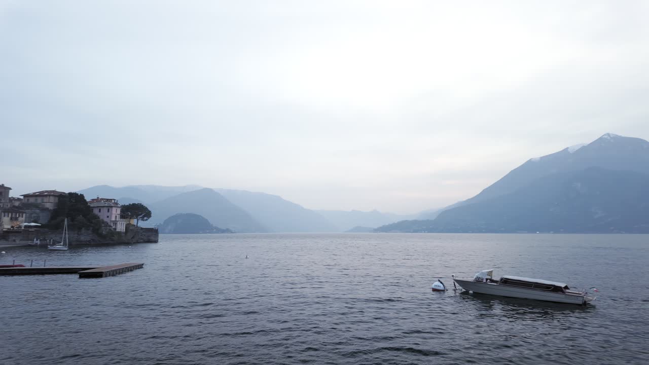 Varenna, panoramic view of of Lake Como on a hazy afternoon, Italy