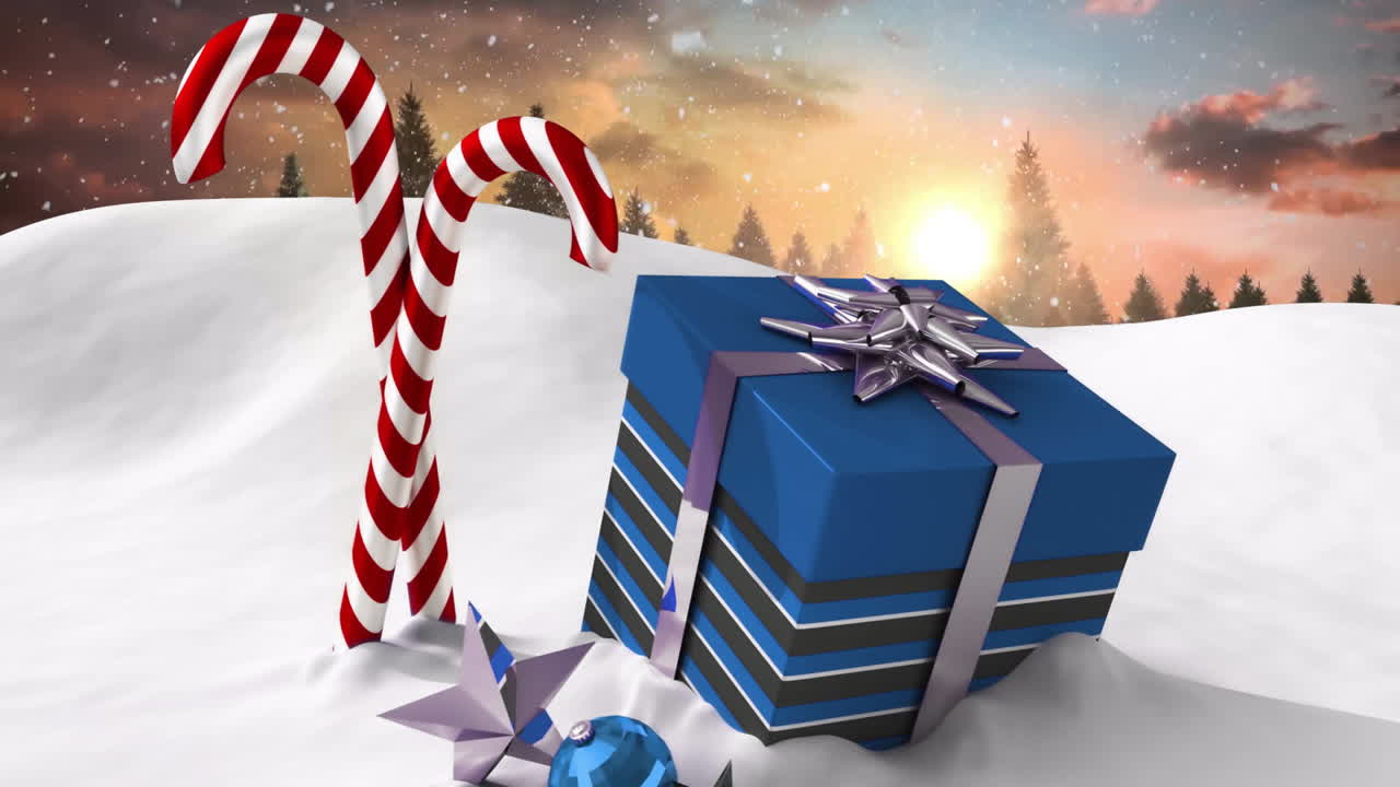 Christmas gift box and candy canes animation over snowy landscape with sunset