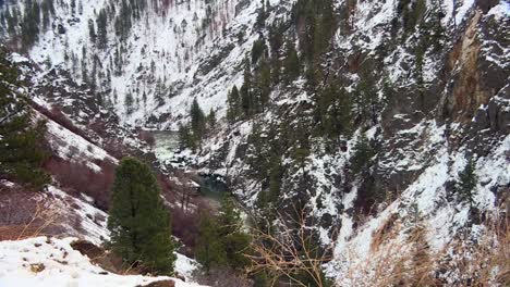 Snow-Covered-Forest-Mountains-Through-The-River-In-Boise-National-Forest,-Idaho,-United-States