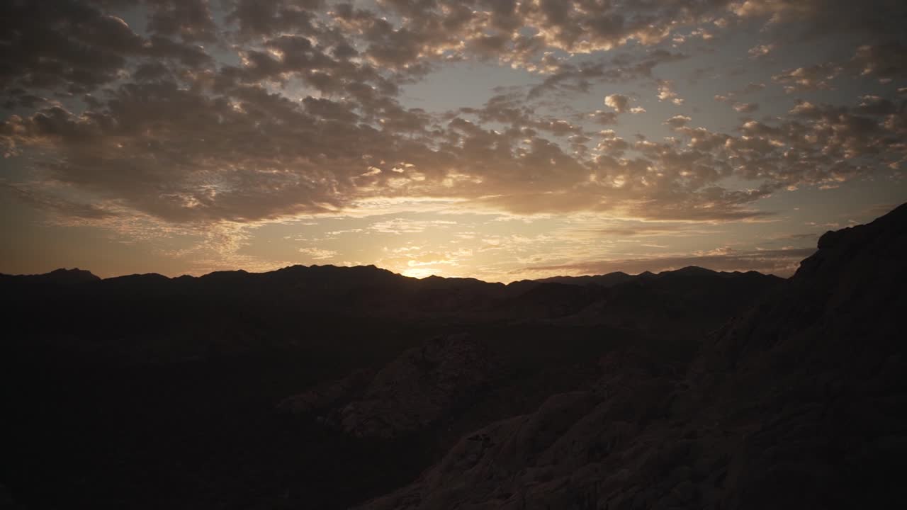 Panorama Of Dramatic Sunset Over Mountain Landscape. pan right