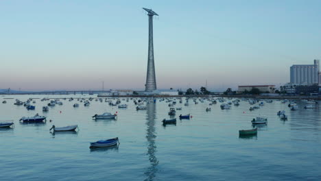 Aerial---Pylon-of-Cadiz-and-the-Castle-of-San-Lorenzo,-Cadiz,-Spain,-wide-shot