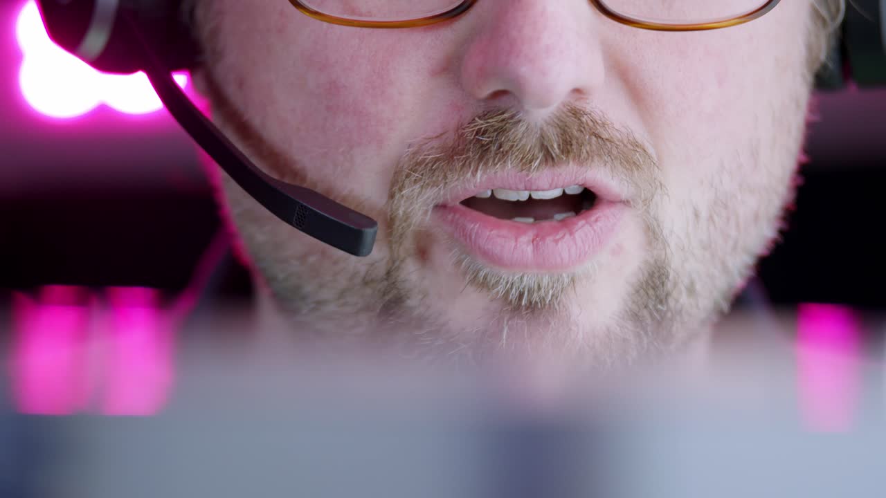 Face close-up: Male service rep conversation on telephone head set