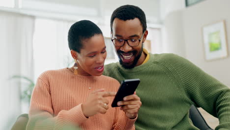 Home,-smile-and-black-couple-with-a-smartphone