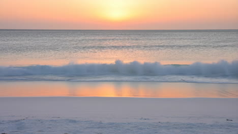 serene sunset over a coastal beach with gentle waves