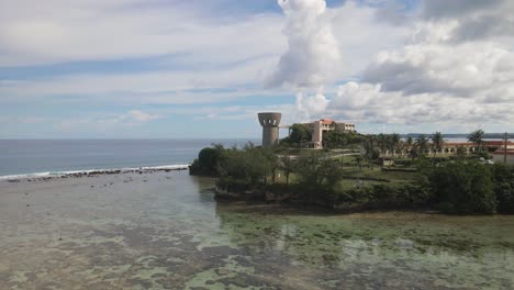 Drone-shot-rising-up-over-the-governors-complex-to-view-downtown