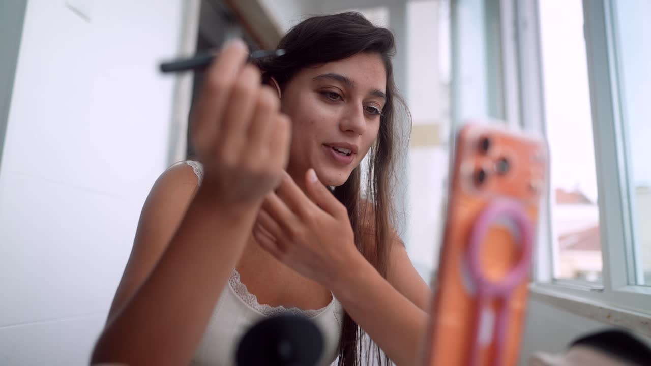 Young Woman Applying Makeup with Elf Ears for Social Media