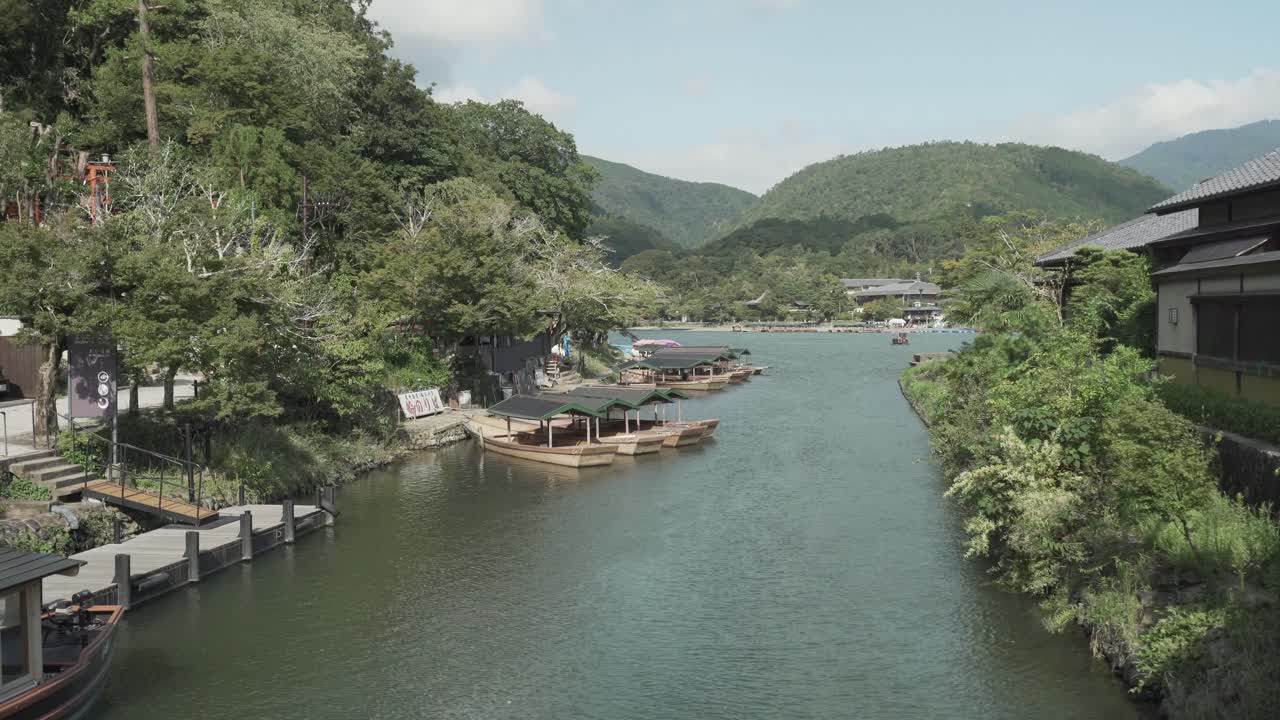 A stunning hillside view of Boats moored on the Katsura River in Kyoto, Japan