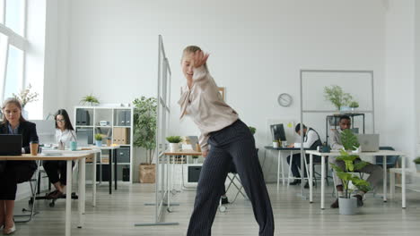 happy office workers dancing
